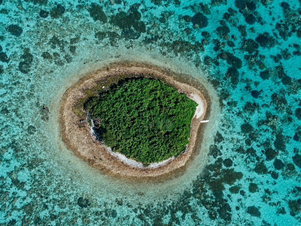 an aerial view of an island in the middle of the ocean