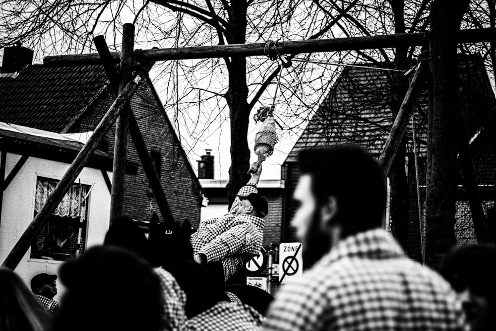 a crowd of people watching a man on a stage