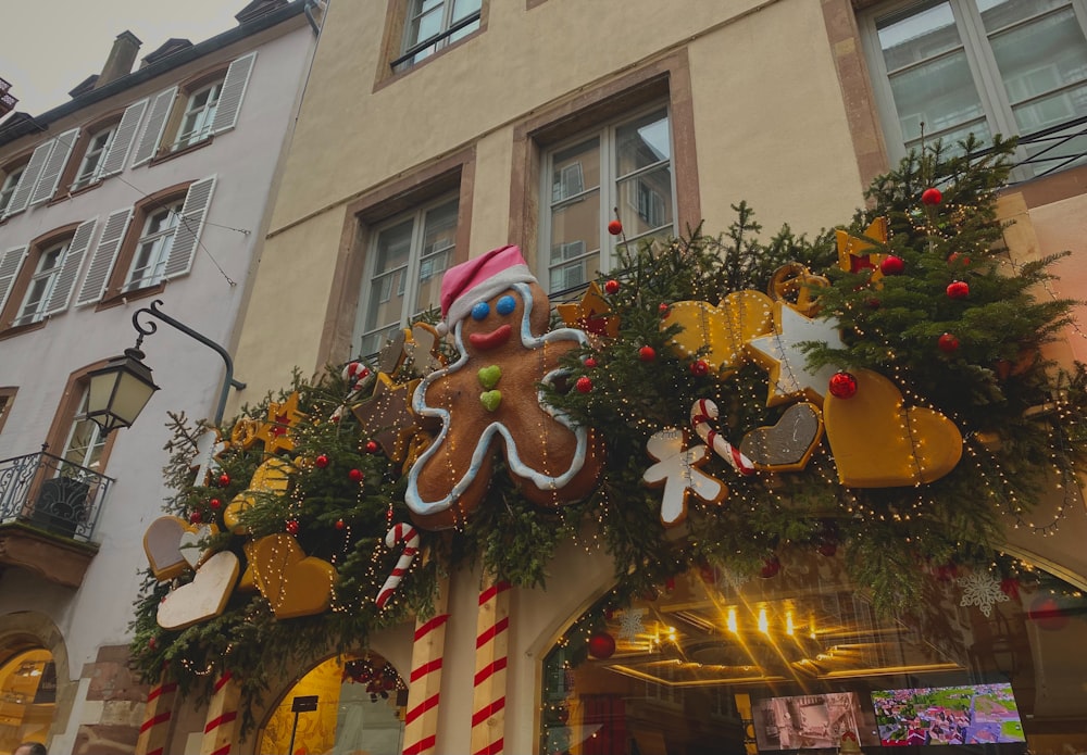 a building decorated with christmas decorations and a gingerbread man