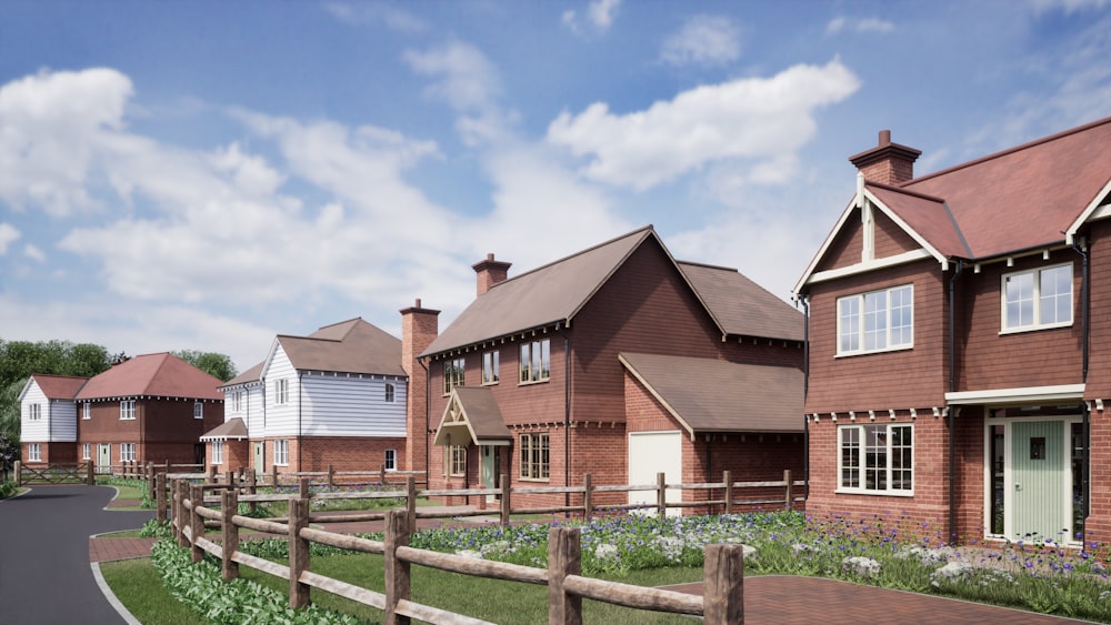 a row of red brick houses next to a road