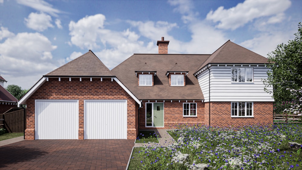 a large brick house with two garage doors