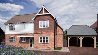 a two story brick house with a garage