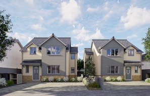 a two story house with a lot of windows