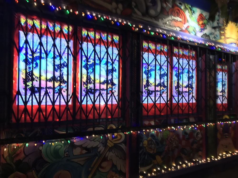 a building with a lot of windows decorated with christmas lights