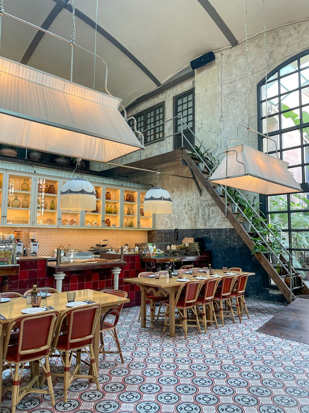 a dining room with a bunch of tables and chairs