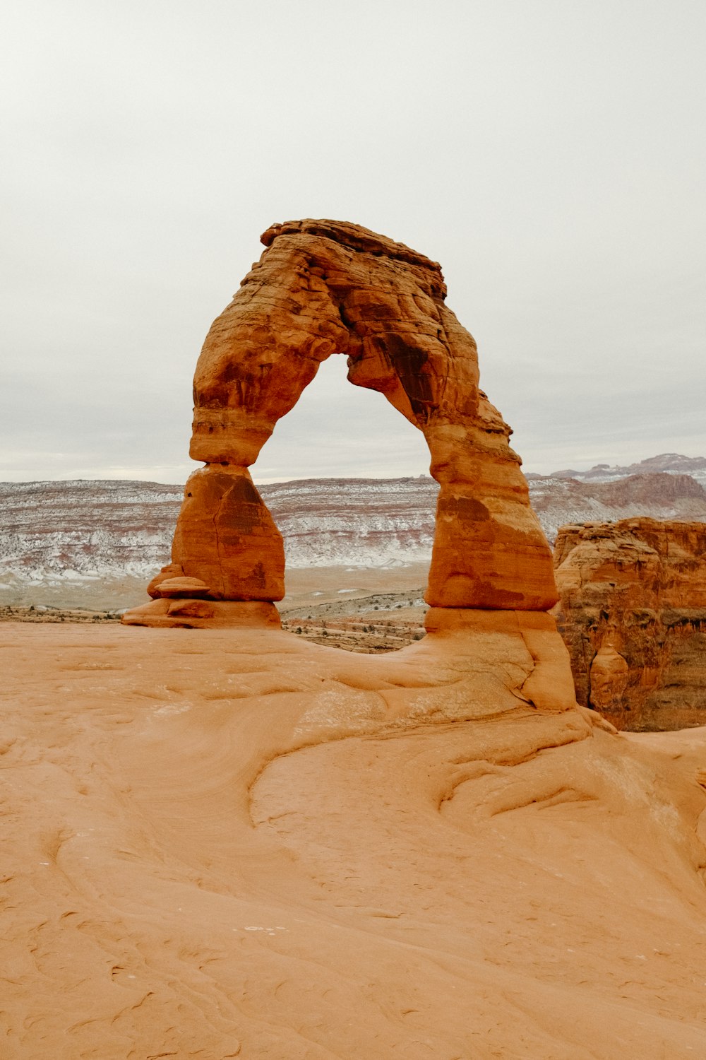 a large rock formation in the middle of a desert