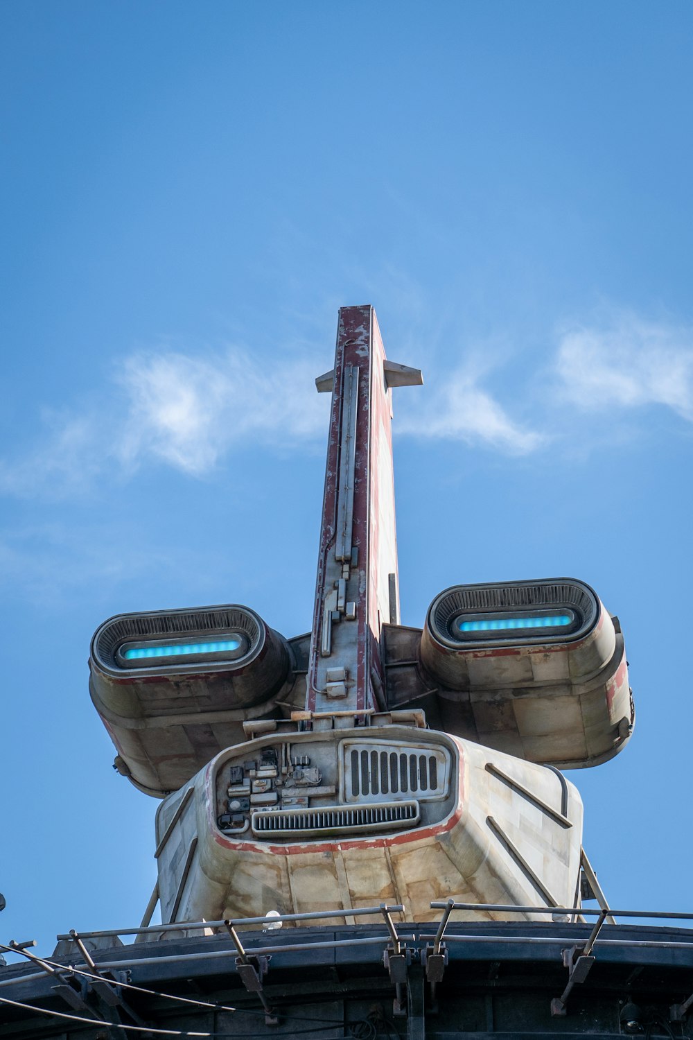 a close up of the top of a building with a sky background