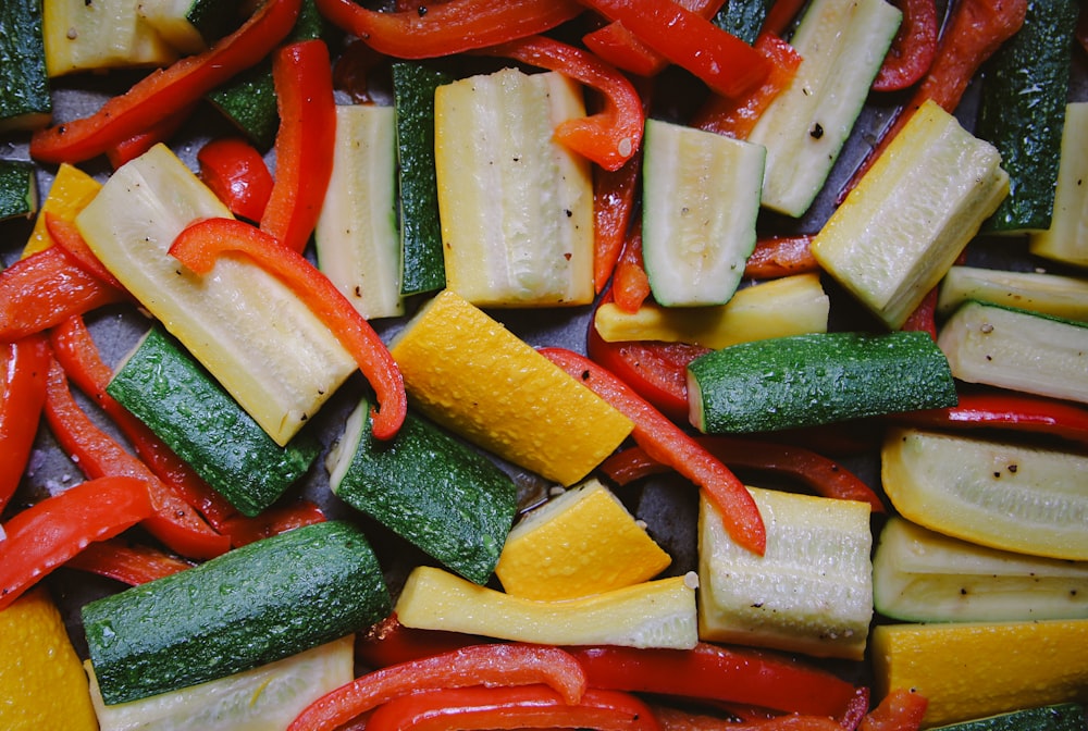 a pile of sliced up vegetables sitting on top of a table