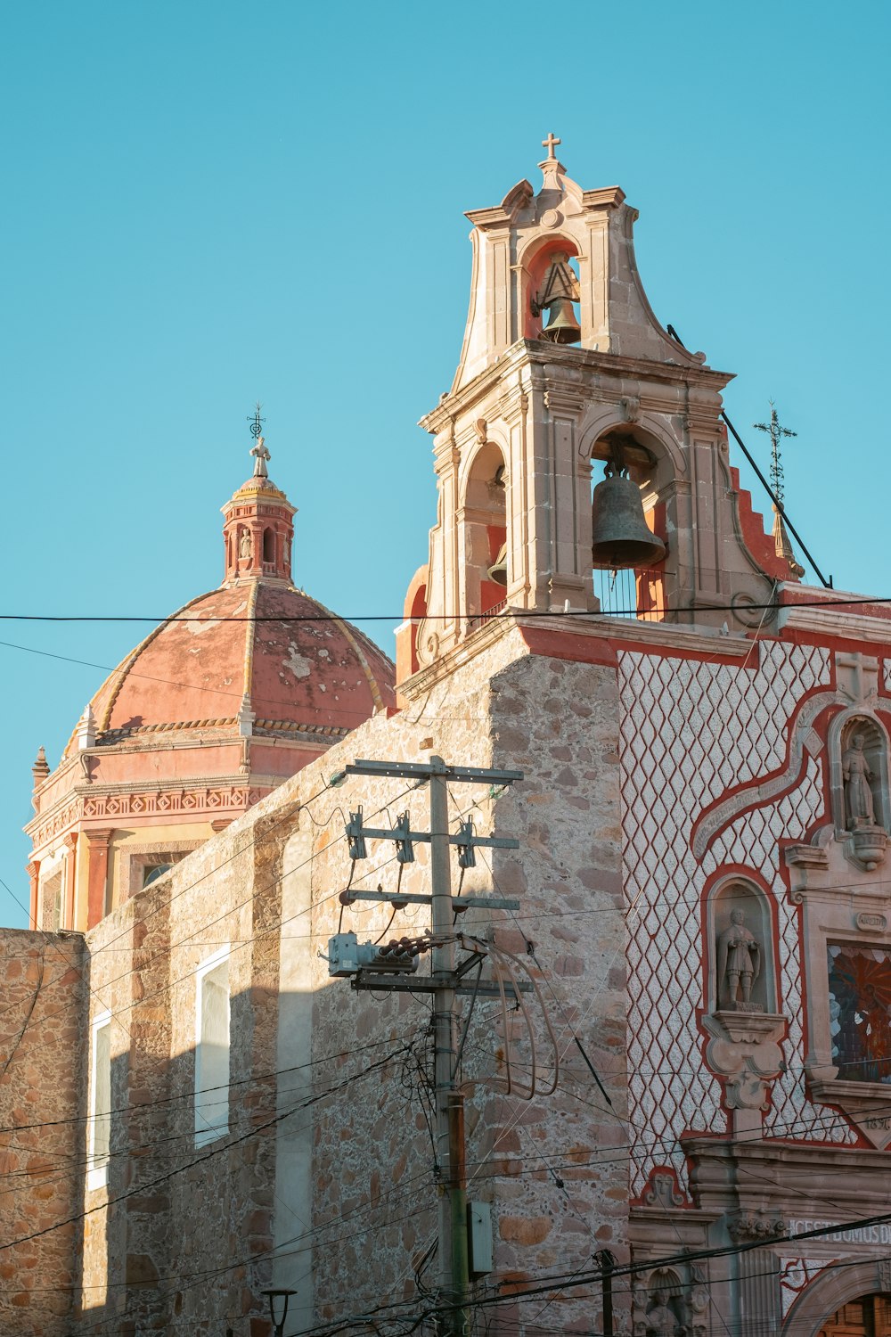 an old building with a bell tower and a clock