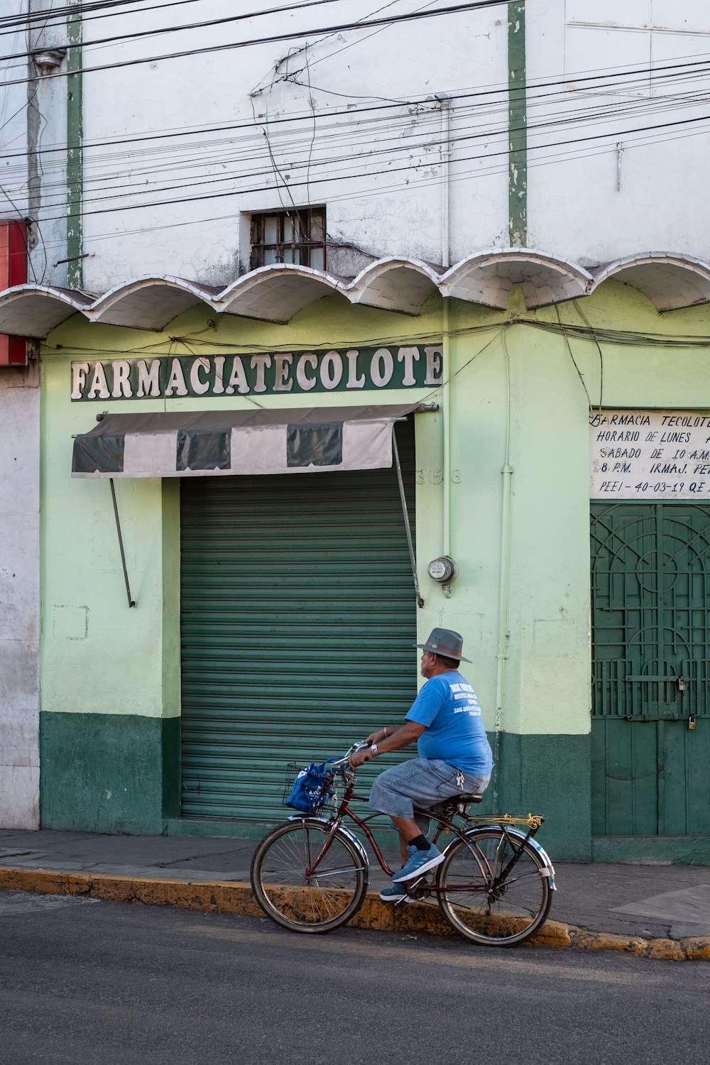 a man riding a bike down the street