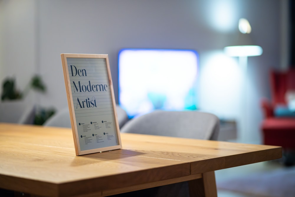 a wooden table with a sign on top of it