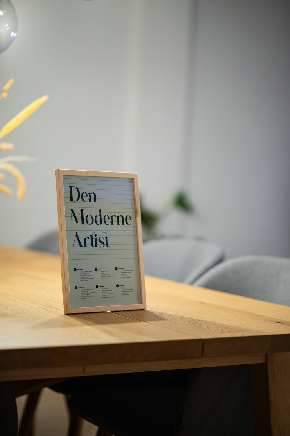 a wooden table with a sign on top of it