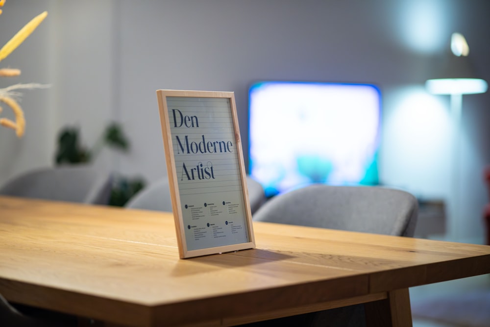 a wooden table with a sign on top of it