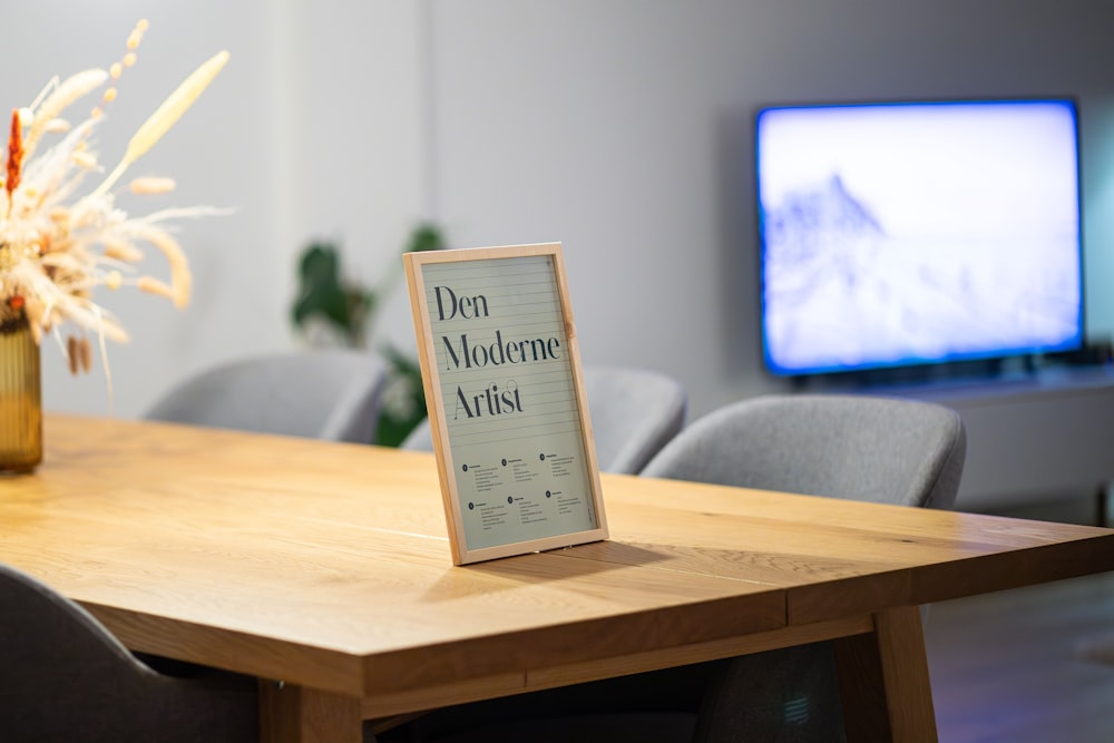 a wooden table with a sign on top of it