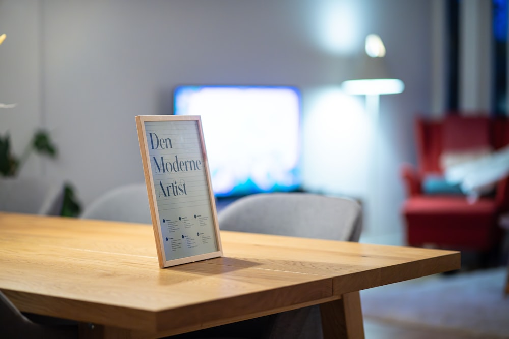 a wooden table with a sign on top of it