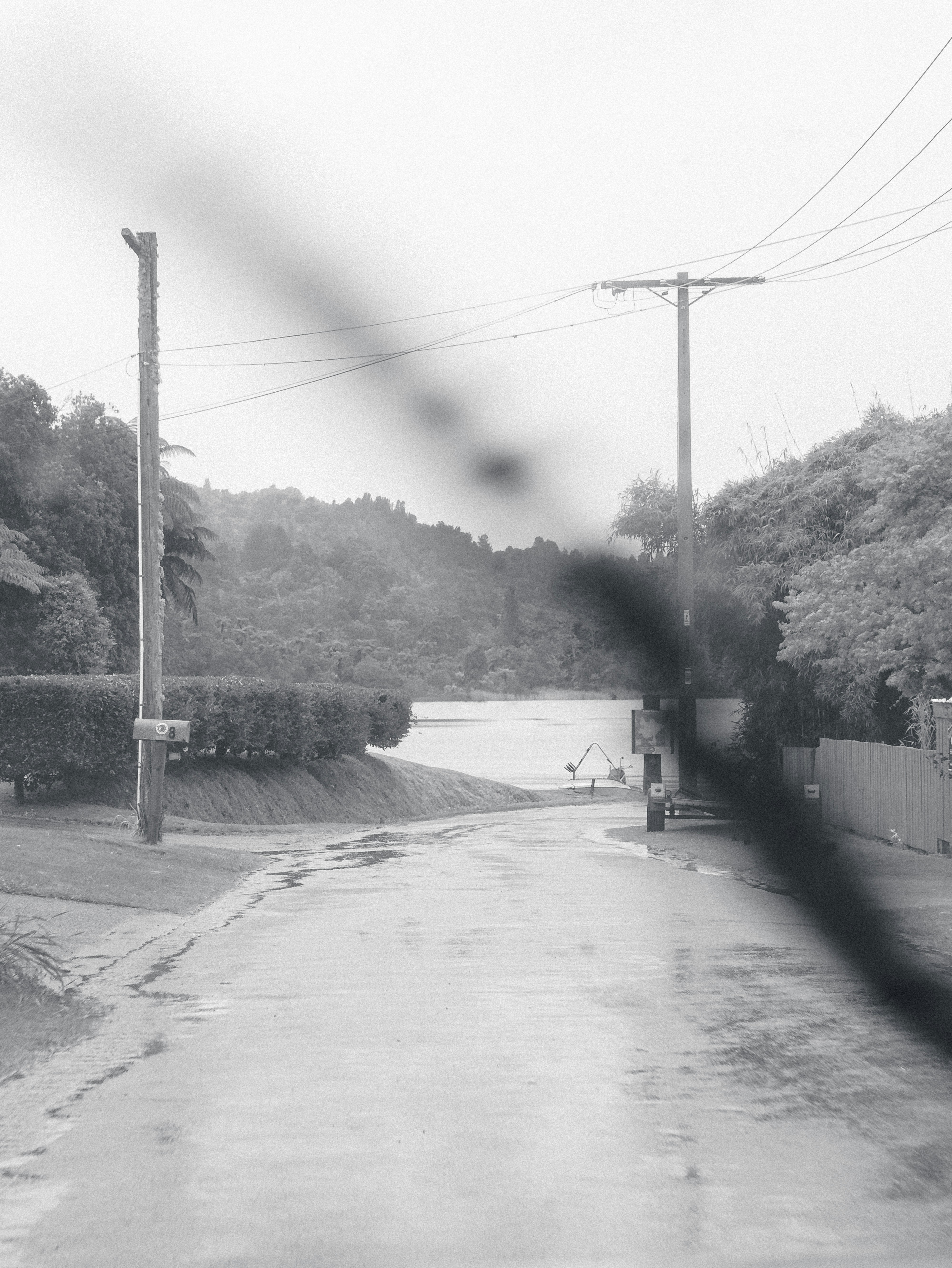 a black and white photo of a flooded street