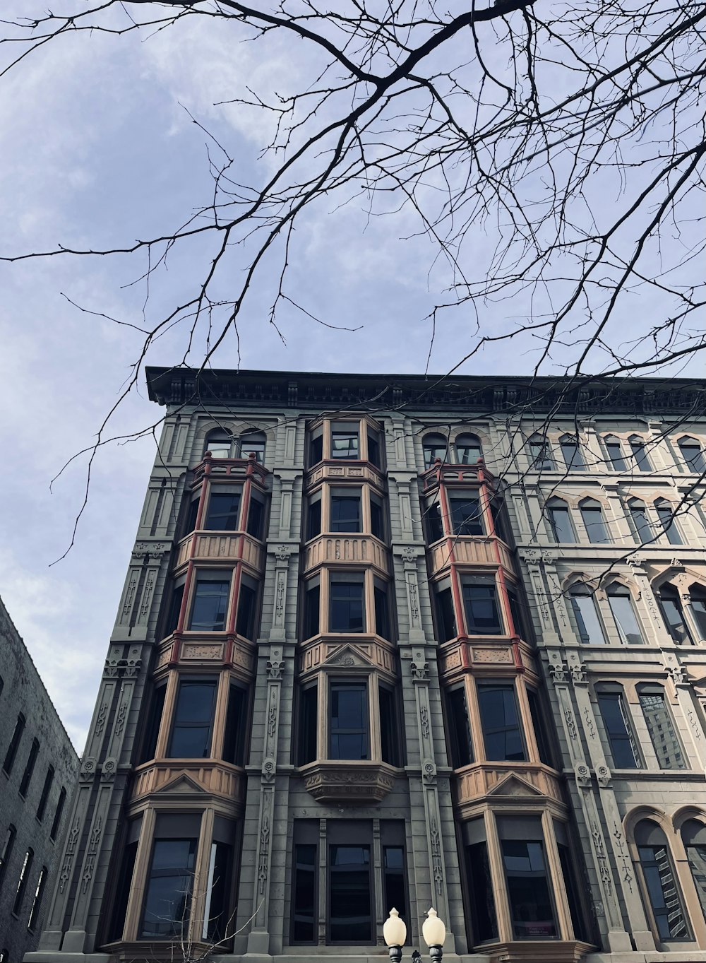 a tall building with a clock on the front of it