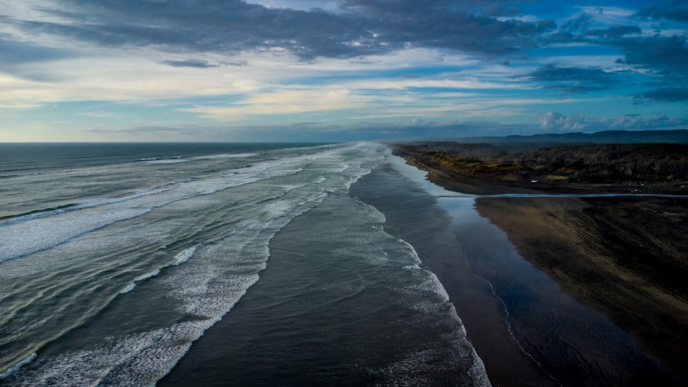 an aerial view of a beach and the ocean