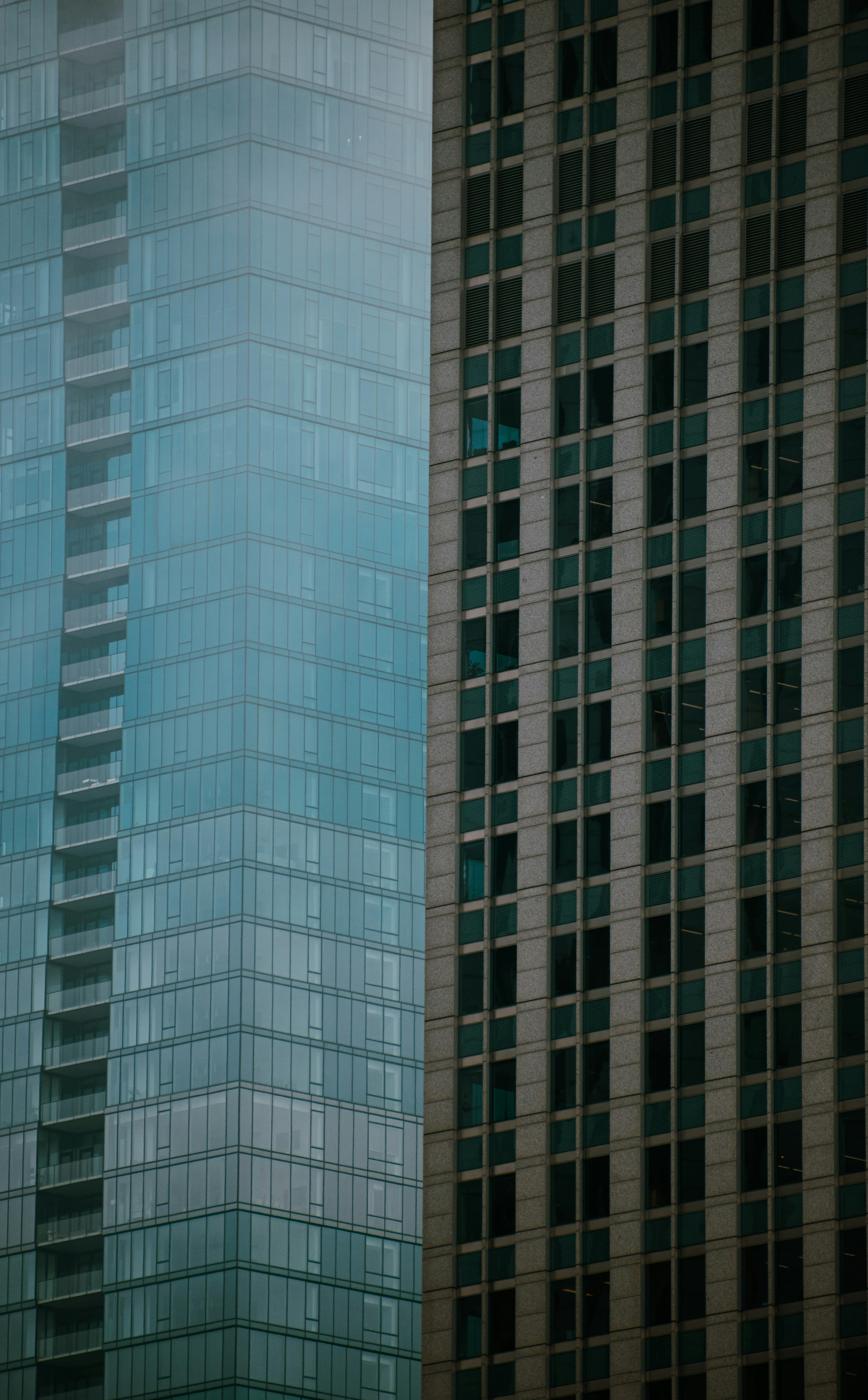 a couple of tall buildings next to each other