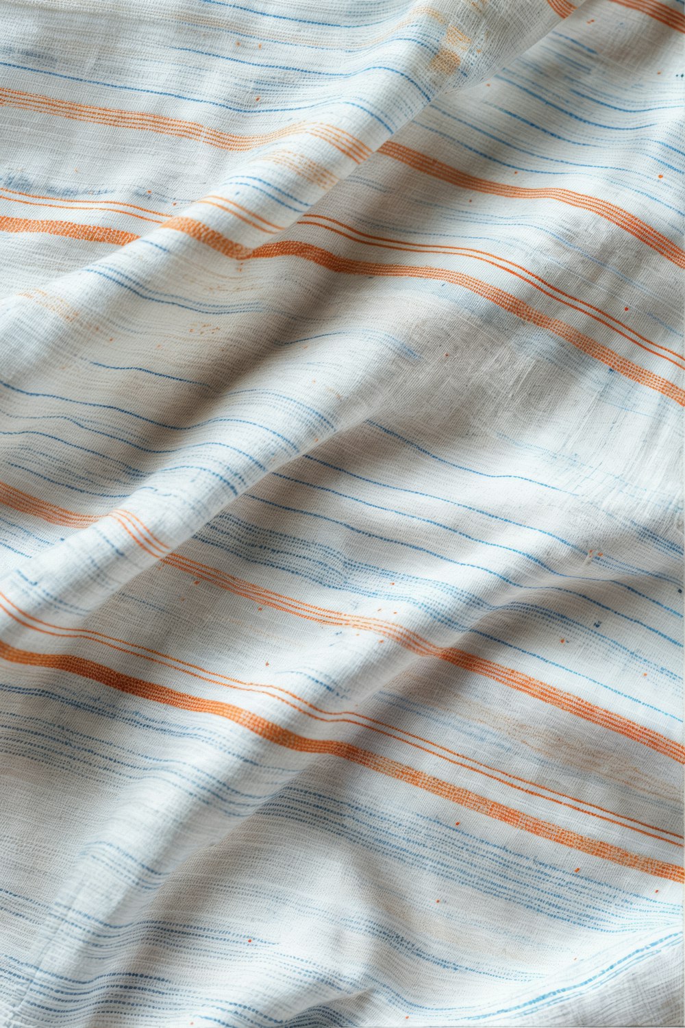 a close up of a white and orange striped fabric