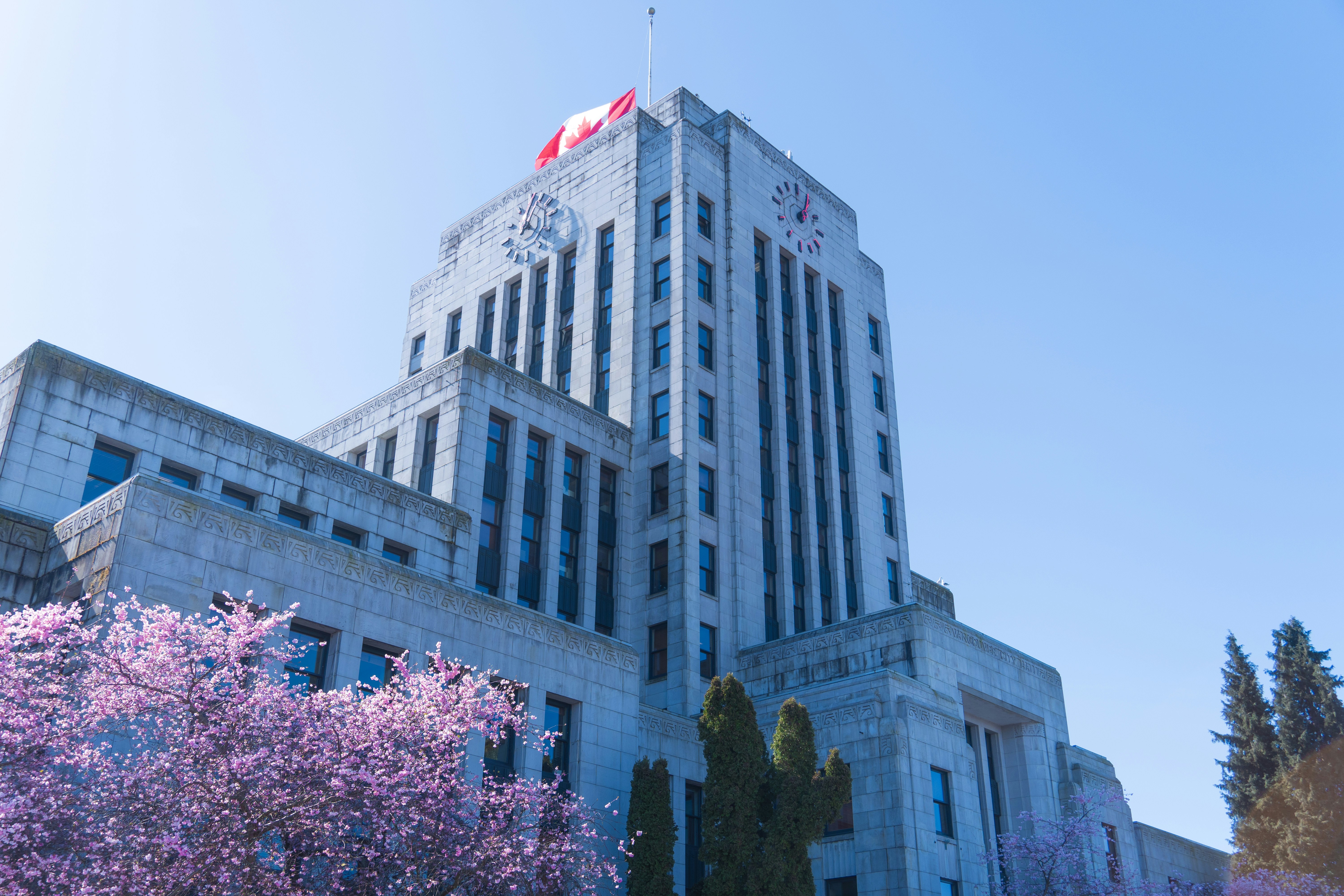 a tall building with a flag on top of it