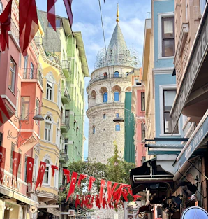 a city street with a tower in the background