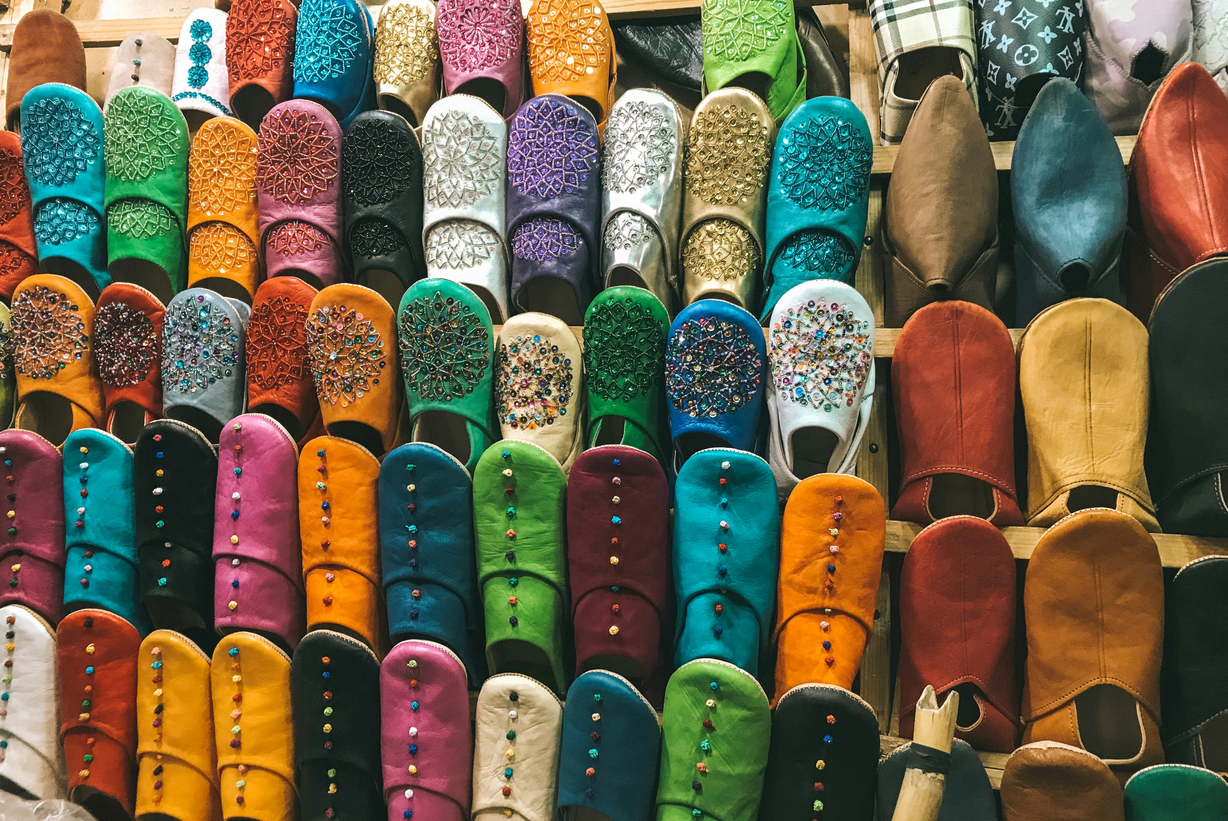 a bunch of shoes that are stacked on top of each other