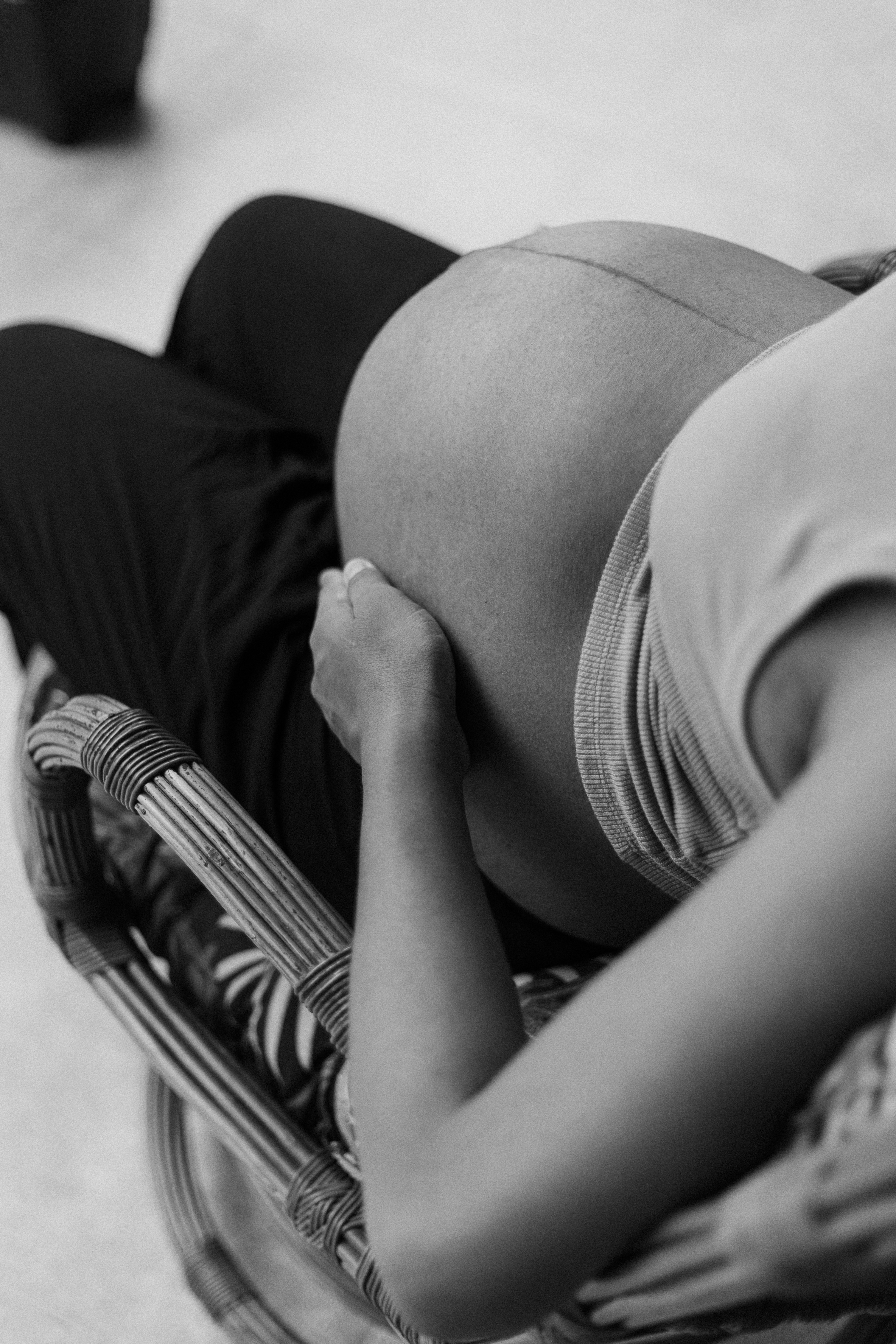 a black and white photo of a pregnant woman