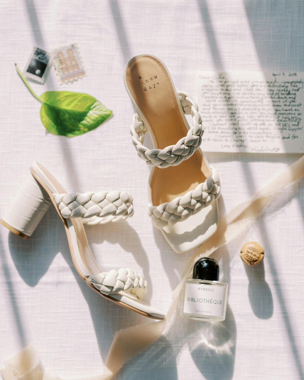 a pair of white shoes sitting on top of a table