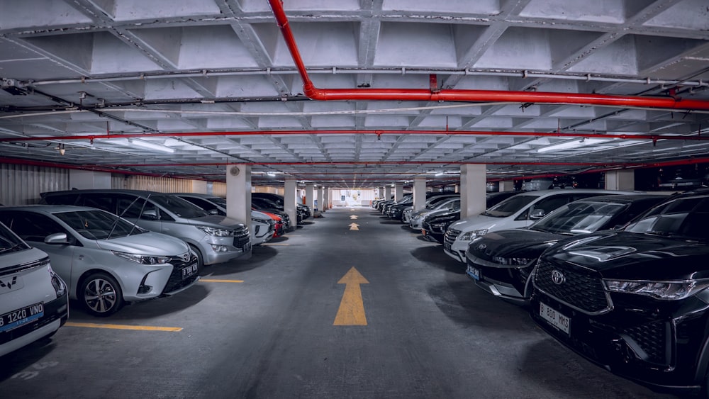 a group of cars parked in a parking garage