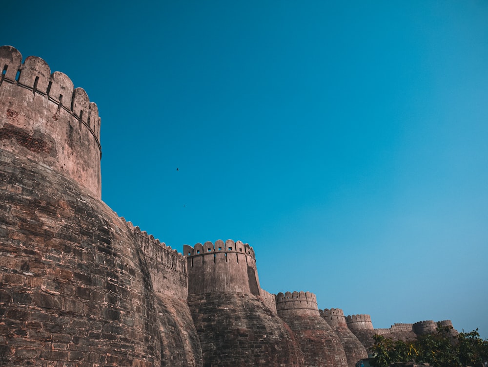 a castle like structure with a blue sky in the background