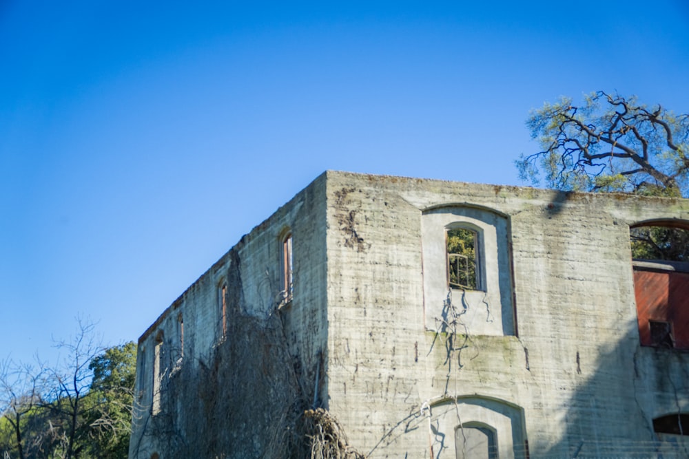 an old building with a clock on the side of it