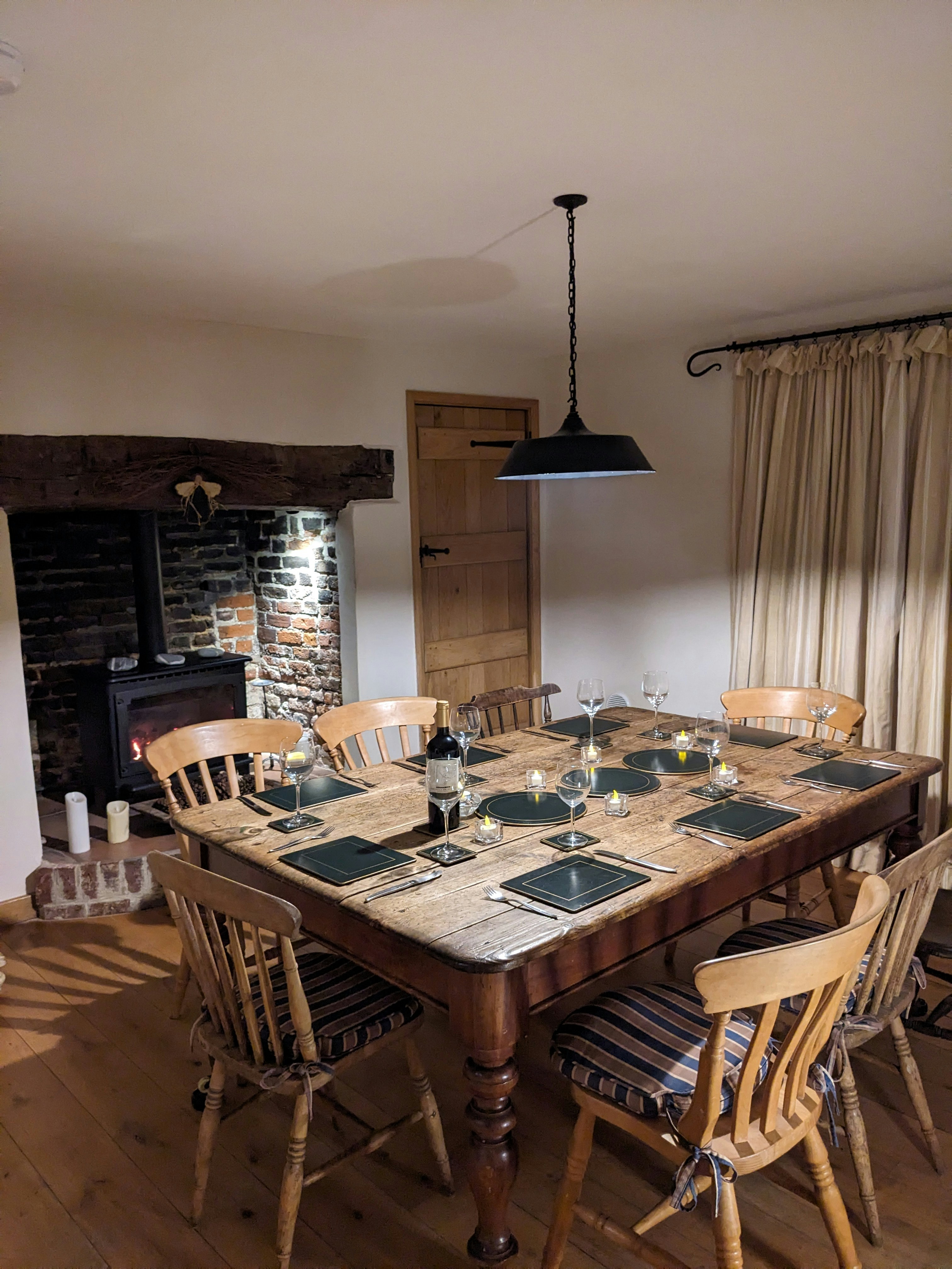French countryside dining table with truffles and wine, candlelight, dark rustic atmosphere