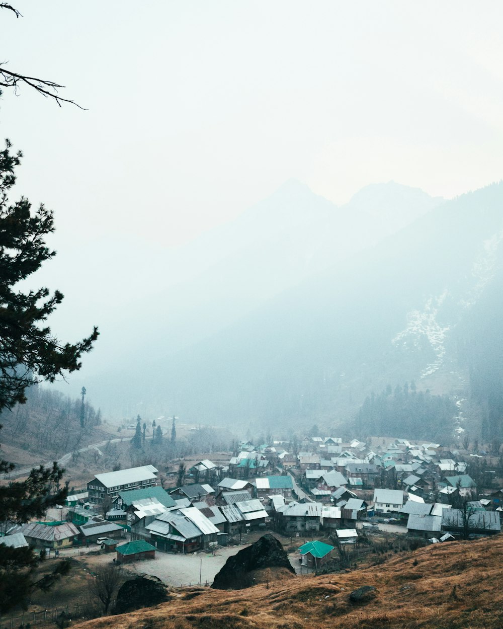 a view of a small village in the mountains