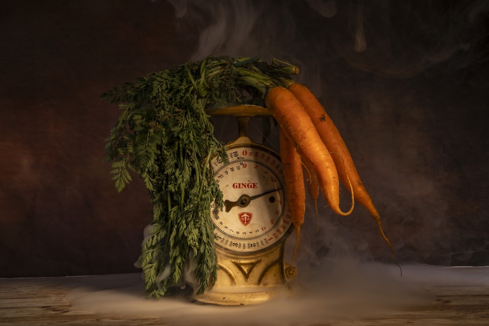 a clock with carrots on top of it