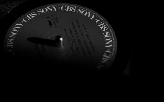 a black and white photo of a record