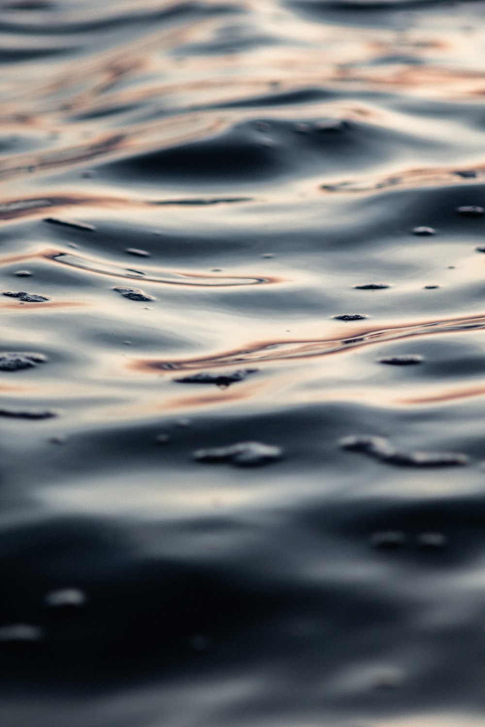 a close up of a body of water with waves