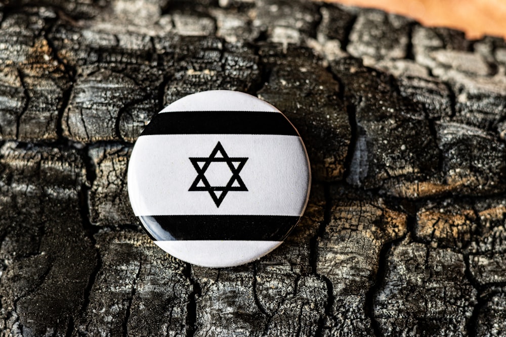 a button with a star of david on it