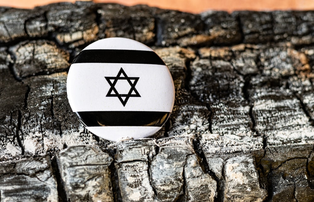 a button with a star of david on it