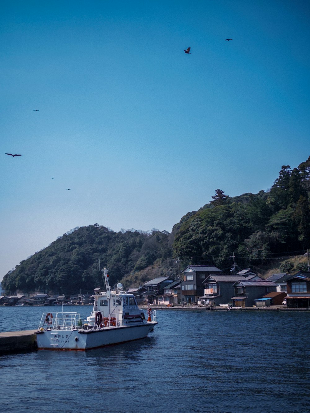 a boat is in the water near a dock