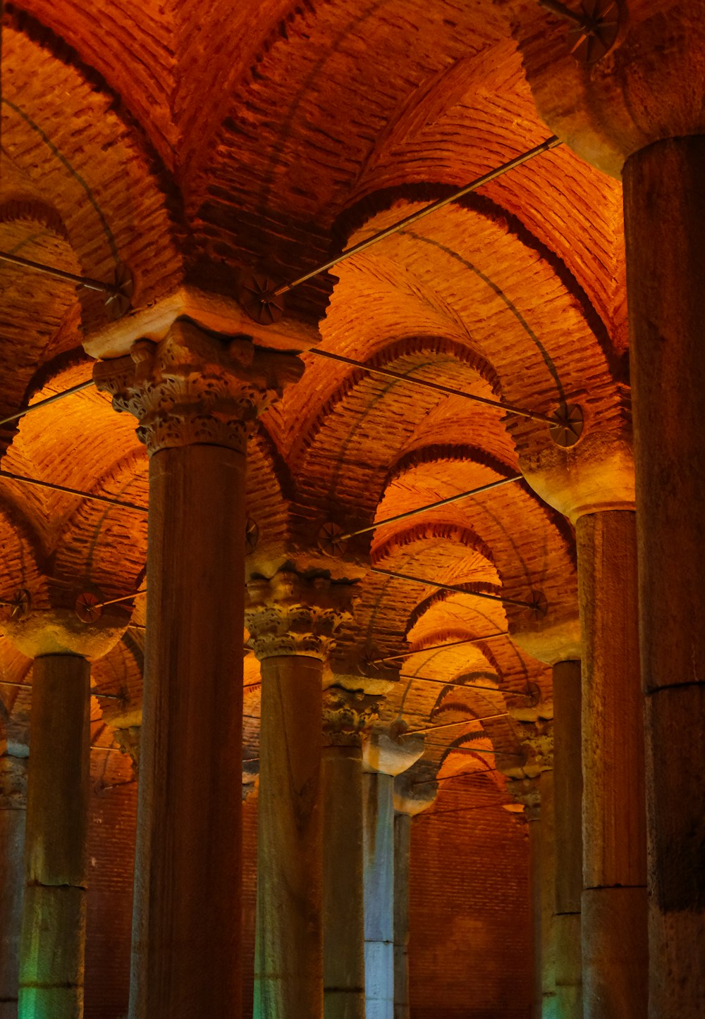 a large room filled with columns and lights