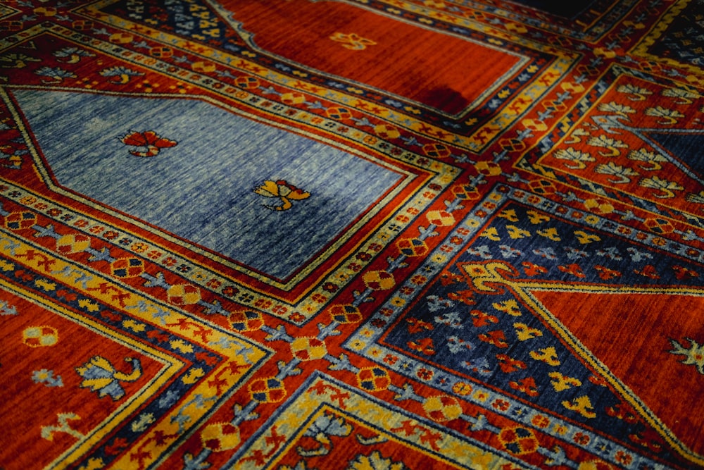 a close up of a colorful rug with many different colors