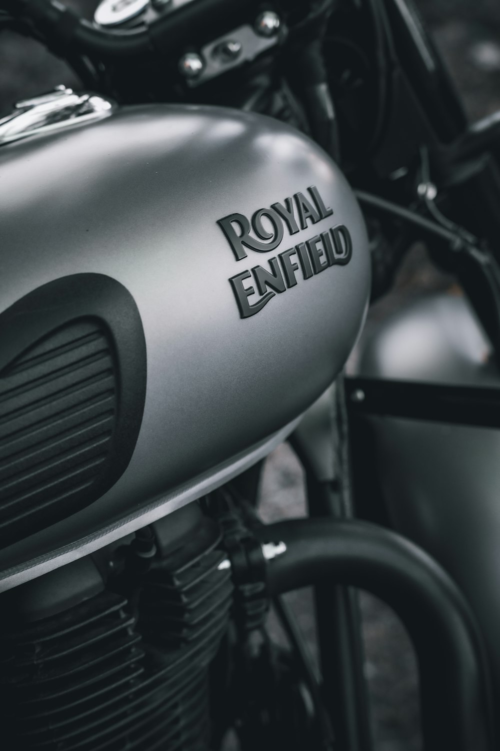a close up of the royal enfield logo on a motorcycle
