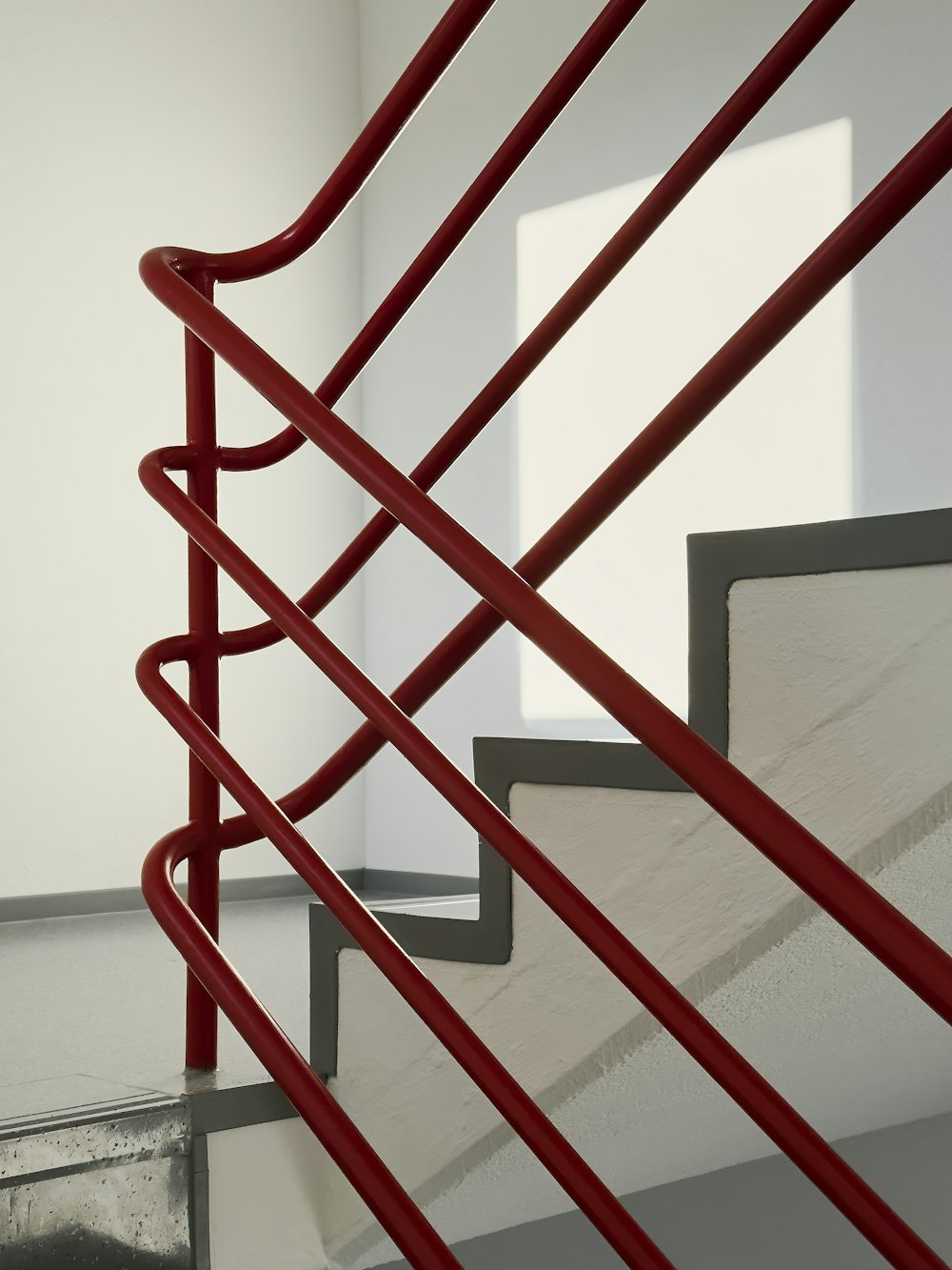 a close up of a red metal stair rail