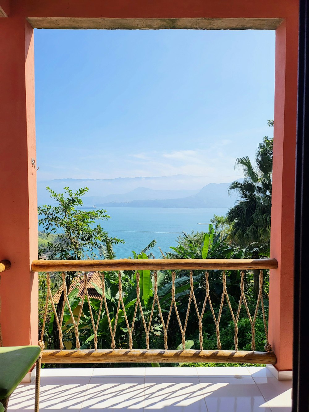 a balcony with a view of the ocean