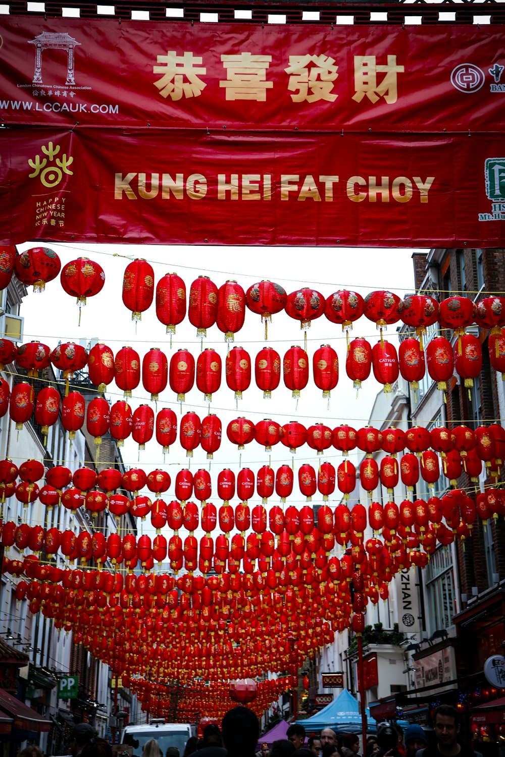 a street filled with lots of red lanterns