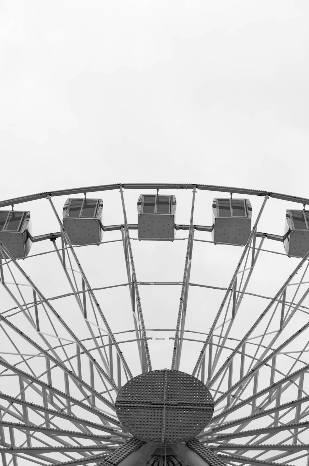 a black and white photo of a ferris wheel