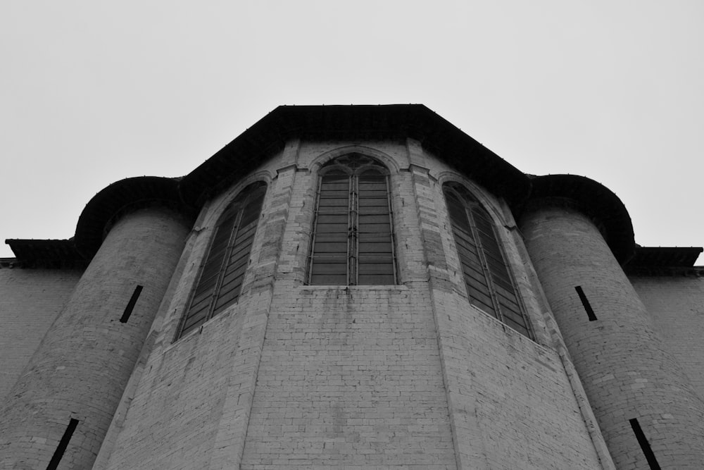 a black and white photo of a clock tower