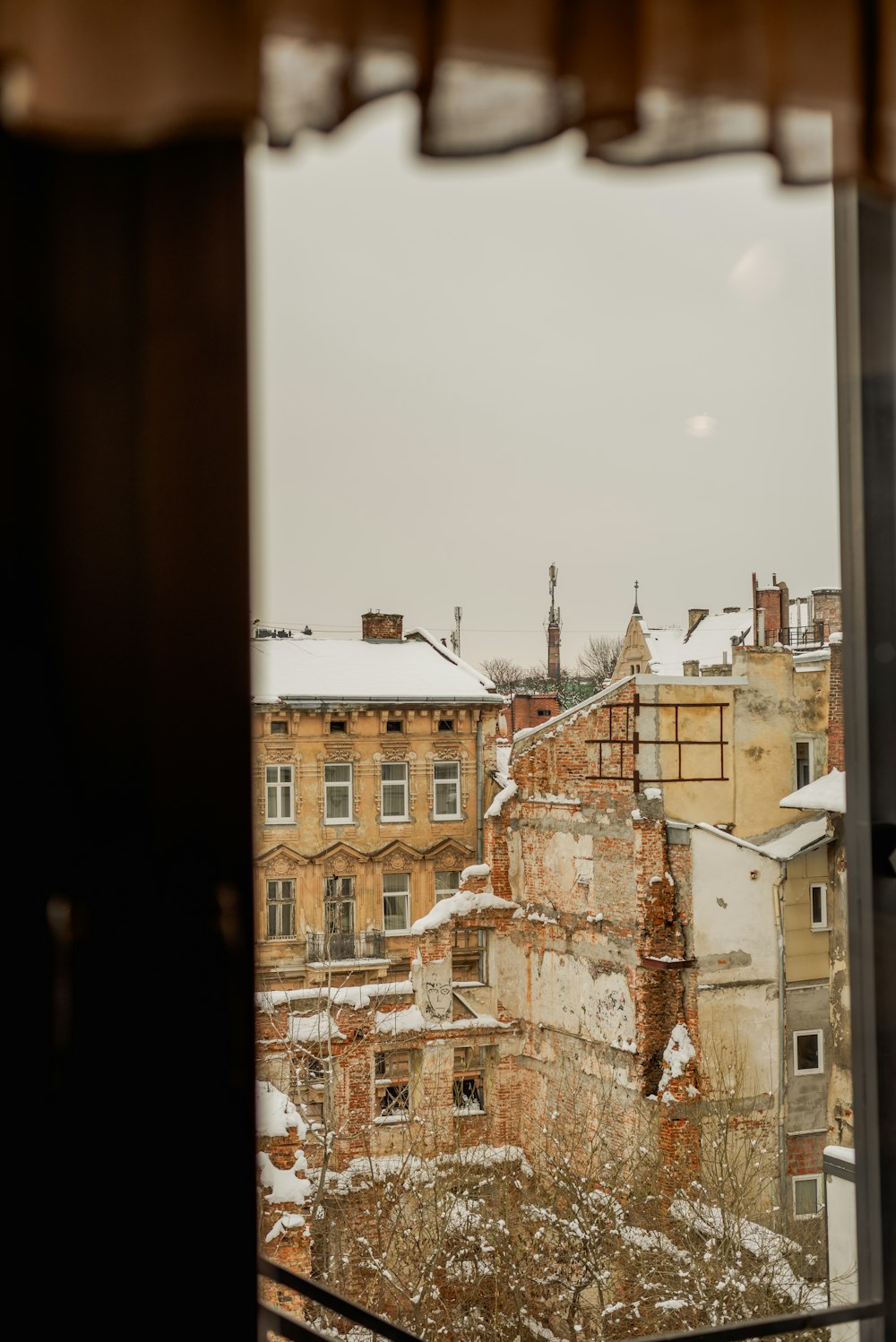 a view of a snowy city from a window