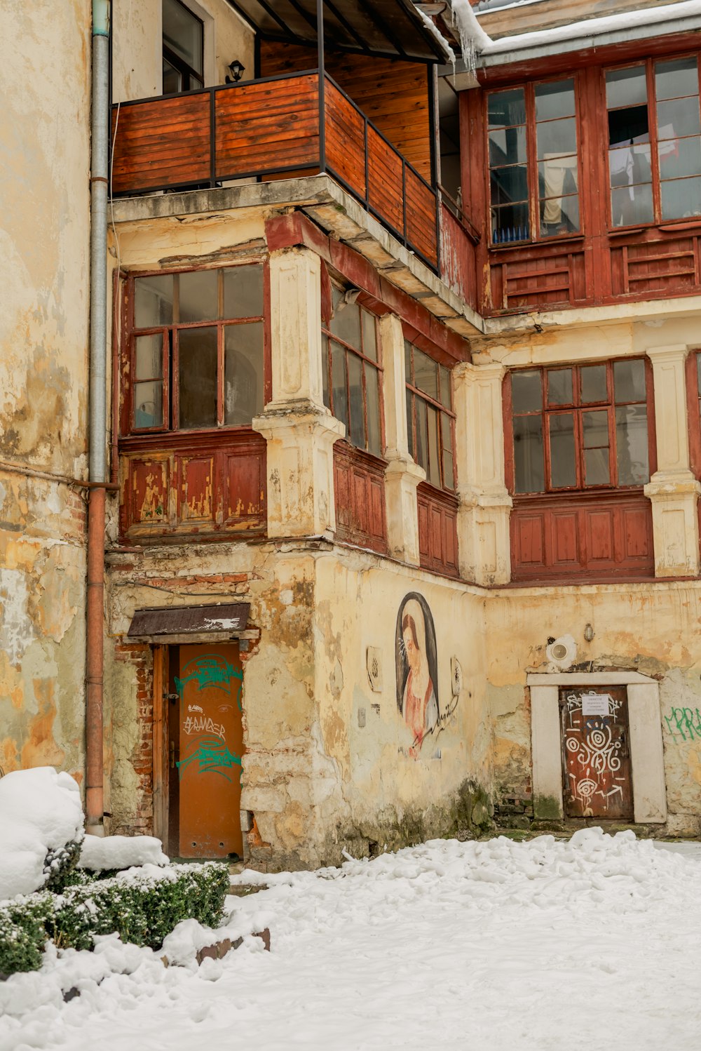 an old building with snow on the ground